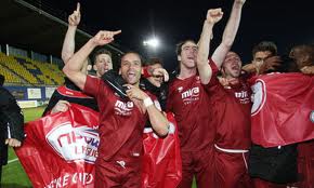 Cheltenham players celebrate reaching Wembley.